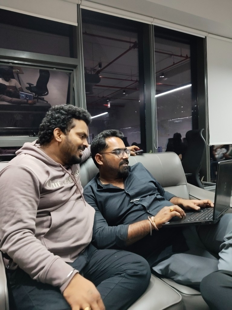 Colleagues collaborating on a laptop