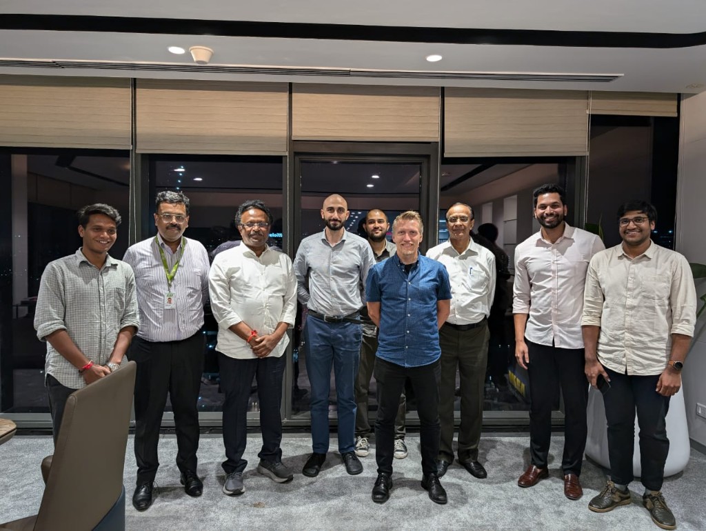 Team group photo in the office at night